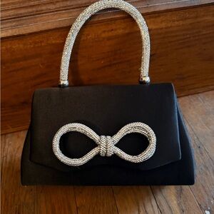 Elegant Black Clutch with Silver Bow Accents